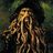 Pixelated image of a character with long dreadlocks and a dark hat on a blue background with pixelated text.