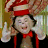 Two animated frames of a cartoon character in red hat and bow tie making peace signs against a blurred background with another figure.