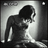 Black-and-white image of a woman in a sleeveless dress sitting with head bowed, text 'alone' and star symbol visible at top left.