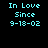 Four pixelated display cyan text reading "In Love Since 9-18-02" against black and magenta backgrounds with varying gradient effects