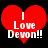 Two red heart-shaped icons with white text reading "I Love Devon!!" on black background, showing slight pixel variation between frames.