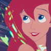 Pixelated close-up of a red-haired character with blue eyes, smiling with visible teeth, against a dark background with green and blue light effects.