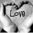 A grayscale pixelated icon featuring a heart outline with the word 'Love' inside, set against a light background.