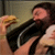 A pixelated image shows a person with long dark hair holding a hamburger, next to text reading "just cant resist a hamburgr".
