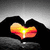 Animated icon shows hands forming a heart shape with sunset colors, text changes from 'i loved you' to 'that's the way'