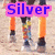A pixelated image of horse legs with orange leg wraps and colorful hoof decorations, overlaid with text reading Silver Valley Stables in blue letters on pink backgrounds.