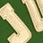 A contact sheet of five animated frames showing a green background with beige text and partial shapes, including letters 'S', 'Y', 'L', 'I', 'C', 'E' and curved elements.