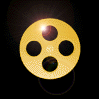 Golden film reel icon with four circular holes, rotating through multiple angles against a black background with lens flares.