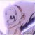 Pixelated image of a stylized face with dark eyes and mouth, light purple and white tones, and dark diagonal lines on the right side.