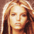 Pixelated static image of a person with long light brown hair and fair skin, rendered in warm tones on a solid background.