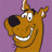 Pixelated cartoon dog head with brown fur, black nose, white teeth, and purple dotted background in 48x48 static icon format.