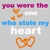 Pixelated text and heart symbols on a gray background with color variations in the text.
