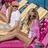 Pixelated image of two people embracing on a bed with striped pillows, next to bright pink background with green text.