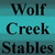 Static image with teal background displaying text: 'Wolf Creek Stables' on left and 'Where howling is pretty normal' on right.