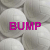 white volleyball-like spheres with pink text labels 'BUMP', 'SET', and 'SPIKE' in the top , transitioning to a lower section showing 'all in a days' work'