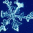 Three light blue snowflakes on a dark blue background with a gray rectangle in the bottom right corner.