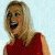 Two side-by-side frames of a pixelated animated icon showing a woman in red sleeveless dress with blonde hair, first laughing widely then smiling subtly against light background.