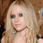 A blonde woman with dark eye makeup and a choker necklace appears in a of four , with the rightmost blank