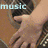 A four- shows a person playing guitar with text overlays; the top-left displays 'music' in light blue, while the bottom-right is blank