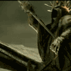 Animated sequence of a hooded figure with spiked crown holding sword and torch, transitioning from raised sword to flame-torch in dark architectural setting.