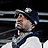 A 4-frame contact sheet of a G-Unit logo animation featuring three male figures in various poses with red curtain background and stylized text.