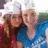 Two people in blue and red clothing pose together with white head coverings, text overlays change across frames.