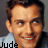 A pixelated image of a person with short brown hair wearing a light blue shirt, showing two variations: one with text and one with a red heart symbol.
