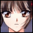 Anime-style character face with brown hair and brown eyes, next to pixelated text on black background.