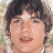 Pixelated image of a person with dark curly hair and light skin, next to blue text reading 'Jens Icons COM' on white background.