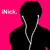 Pixelated image of a person with curly brown hair wearing a light-colored shirt against a patterned background.