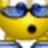 Yellow cartoon character with blue bow, black circular eyes, and red mouth detail, wearing white clothing, against light background.