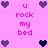 Pixelated pink background with purple and dark purple heart icons surrounding pink text reading "u rock my bed" in three