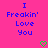 Pixelated text on bright pink background with two green heart symbols at bottom center and right.