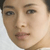 A pixelated close-up of a person's face showing eyes, nose, mouth, and part of the forehead with visible skin texture and subtle shading.