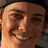 Pixelated portrait of a smiling person with light skin and dark hair, next to pixelated text reading 'ryon sheckler (33)' on white background.