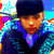 A pixelated image of a person wearing a dark cap and blue patterned clothing against a colorful background with red, white, and blue elements.
