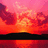 Pixelated sunset scene with orange and pink sky, dark landmass silhouette, and water reflection.