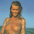 A pixelated image of a woman with long hair standing on a beach, next to green text reading 'Original Icons .com' on a dark background.
