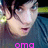 Pixelated close-up of a person with light skin and dark hair, wearing a blue garment, with pink text at the bottom.