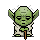 Green pixelated character with large ears holds a brown staff, displays multiple white signs showing text and symbols.
