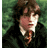Pixelated static image of a person with brown hair and light skin wearing dark clothing against a green background, likely from a Harry Potter–related source.