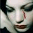 A contact sheet of seven animated frames showing a person with pale skin, dark eye makeup, red lips, and a single vertical red mark on their nose, accompanied by pixelated text phrases forming the sentence "IT ONLY HURTS WHEN IM BREATHING" across multiple frames.