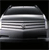 A pixelated grayscale image of a vehicle's front grille with horizontal slats and a central emblem on a dark background.