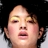 Static 48x48 pixel icon showing a close-up of a person's face with yellow eyeshadow, pink cheeks, and open mouth against black background.