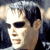 A four- shows a person with dark hair and sunglasses in different poses against varied backgrounds including brick walls and blurred figures