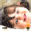 A child with brown hair in pigtails, blue eyes, and a pink hair clip holds an orange flower while smiling; white sparkles overlay the image.