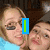 Two people in a selfie pose with text overlays changing across frames: blue vertical bar, orange 'LUV', red 'HER!!' and '<3'