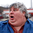 A pixelated image of a person with gray hair in a blue shirt on the left, next to red background text reading "i love you like this fat guy loves cake!".