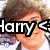 Pixelated image of a person with brown hair and glasses, overlaid with large black-and-white text reading 'Harry C' on a white background.