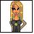 Pixelated cartoon-style icon of a woman with long blonde hair, dark eyes, and an orange face wearing a green top with a white symbol.